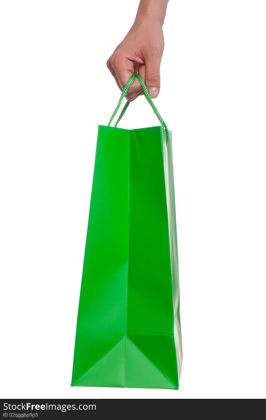 A hand is holding a shopping bag - isolated on a white background