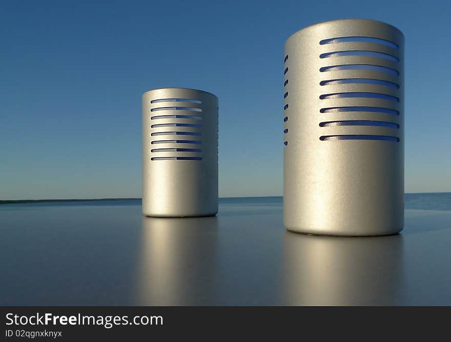 Candle light holder on a plain surface outdoor by the sea and with blue sky. Room for text. Sweden