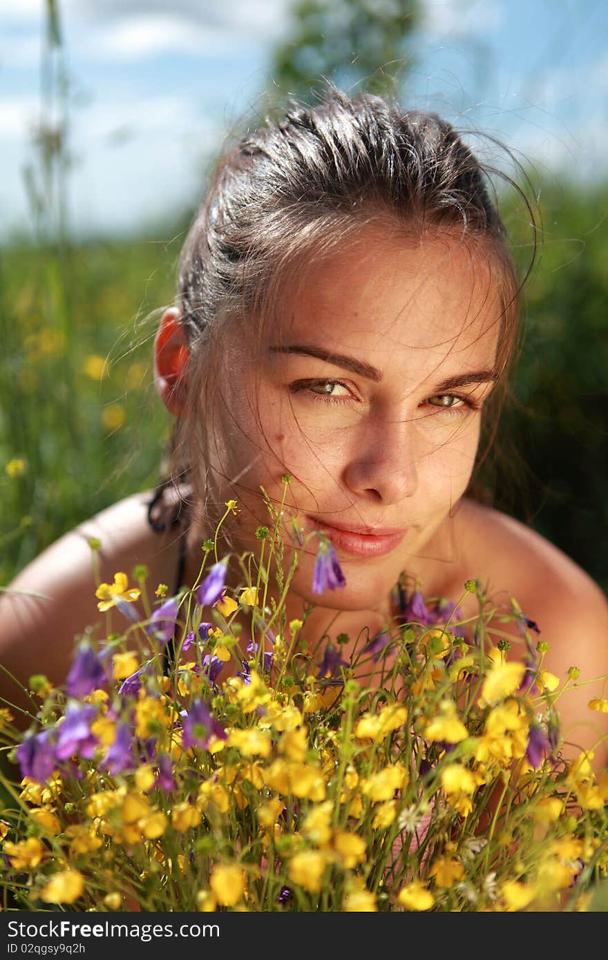 Portrait of a beautiful girl lays on a grass. Portrait of a beautiful girl lays on a grass