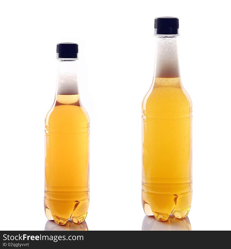 A bottle of beer is slanted with white background