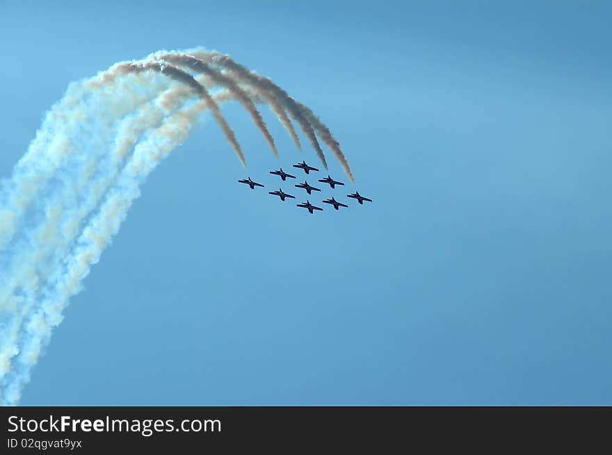 Jet aircraft flying in formation with smoke, room for copy. Jet aircraft flying in formation with smoke, room for copy