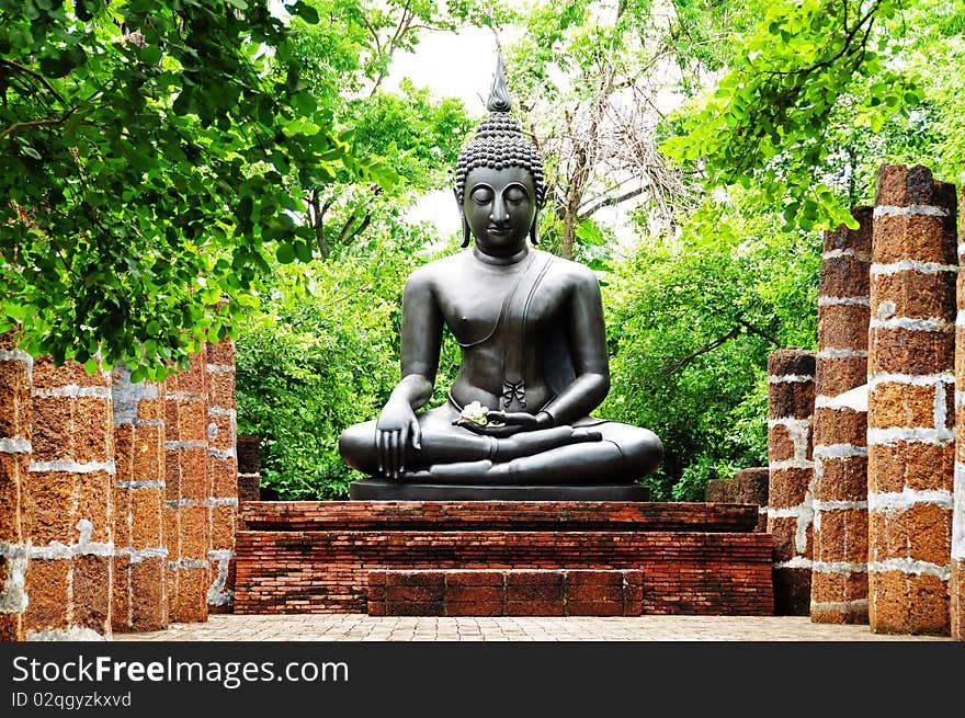 Buddha statue in ruins