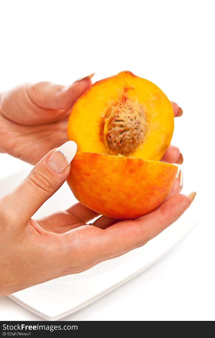 Peach in female hands