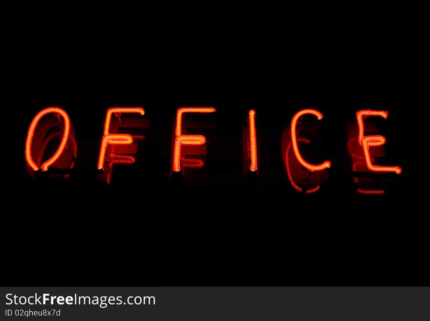 Red neon sign of the word 'OFFICE' on a black background. Red neon sign of the word 'OFFICE' on a black background.