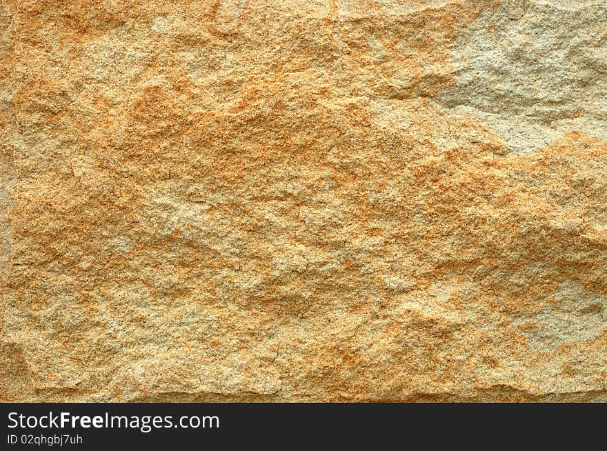 Abstract background from yellow stone wall