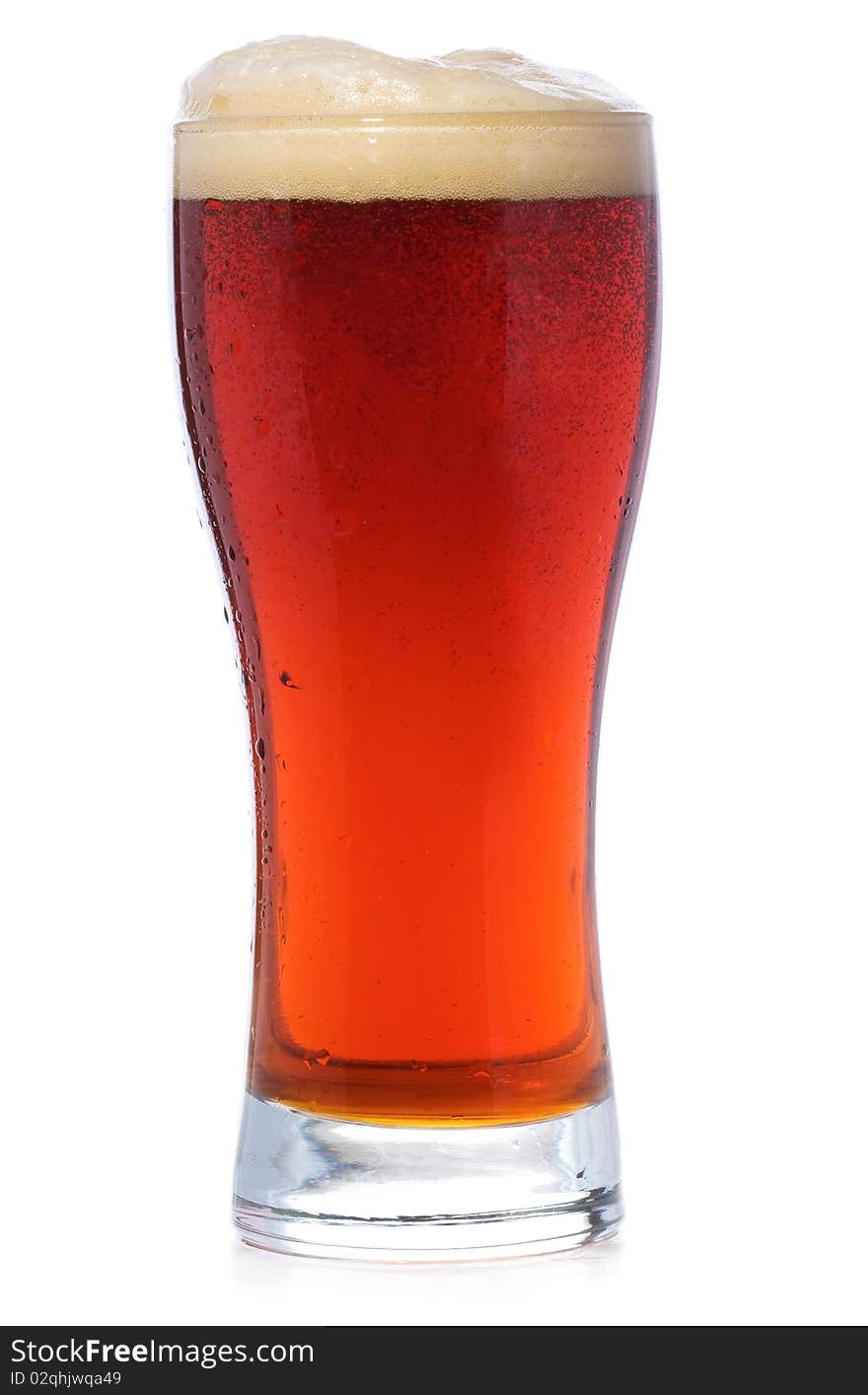 Glass of beer on white background