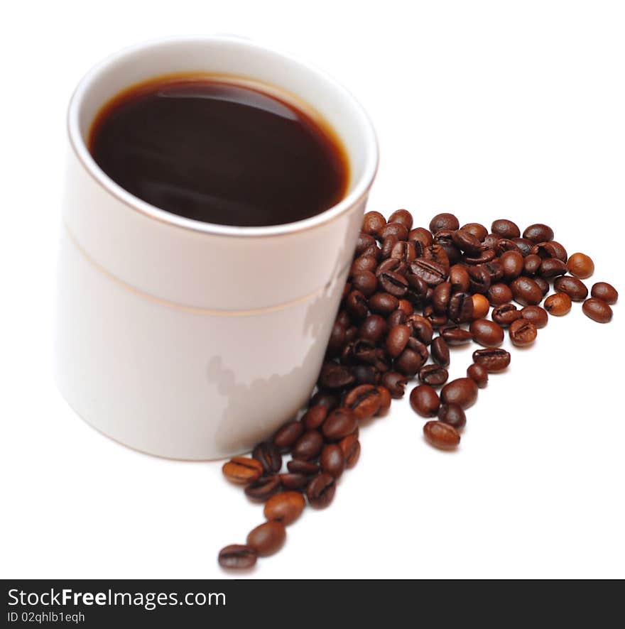 White cup of coffee and coffee beans