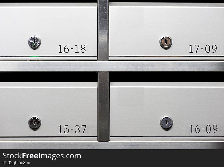 Metallic mailbox array tidy inside apartment houses