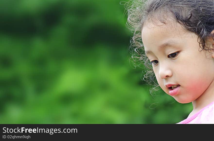 Cute little girl is thinking.