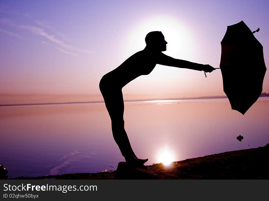 Girl dancer with umbrella on great sunrise. Girl dancer with umbrella on great sunrise