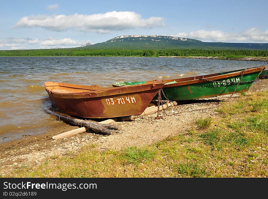 Two small boats on Zuratkul lake in Russia. Summer 2010. Two small boats on Zuratkul lake in Russia. Summer 2010