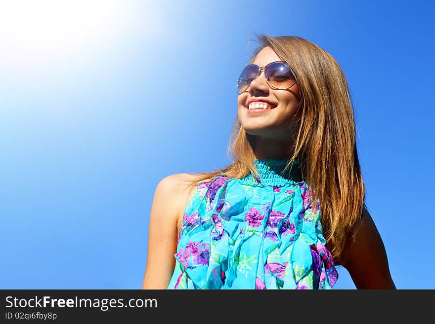 Joyful girl on a blue background on a light background