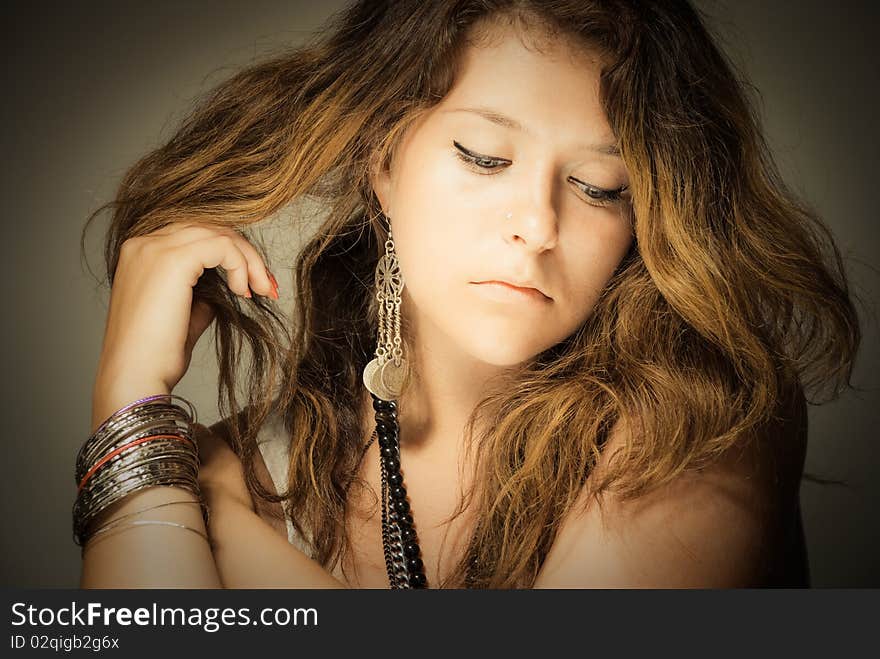 Gently young beautiful woman touching her hair. Gently young beautiful woman touching her hair