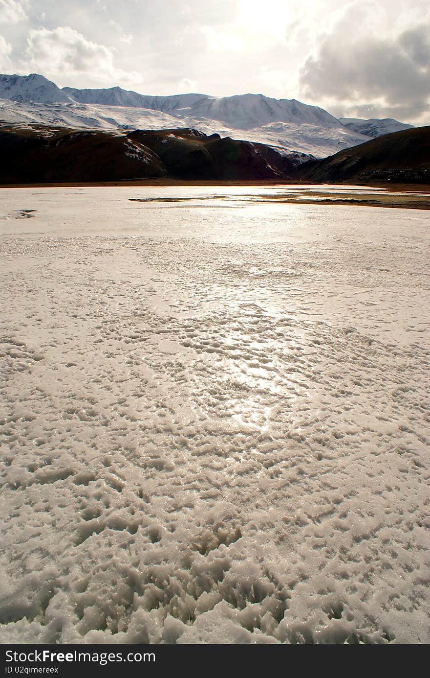 Sunset over  frozen Tsomoriri lake in Indian Ladakh