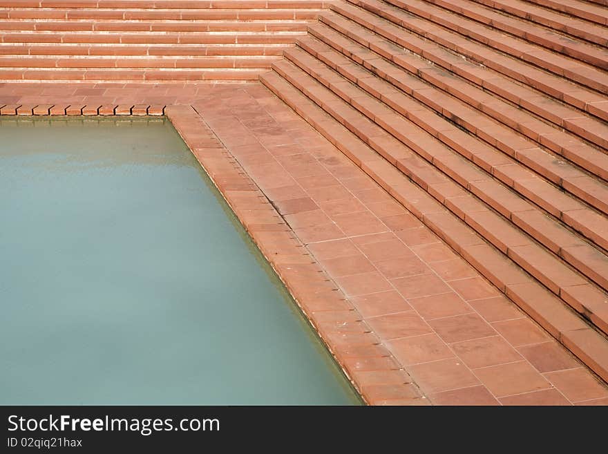 Pool with stairs at Lotus Temple in Delhi.