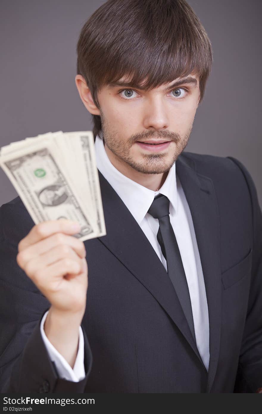 Businessman with dollars in the hand