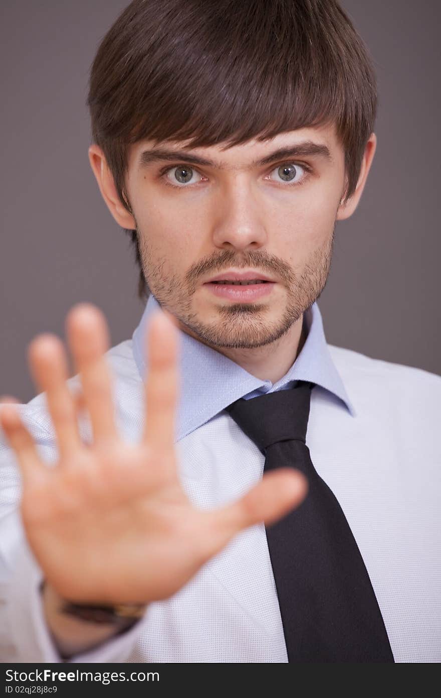 Businessman stretching out his hand in a stop sign