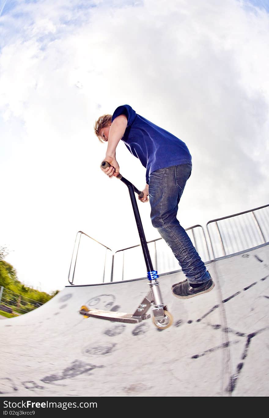 Boy Going Airborne With Scooter