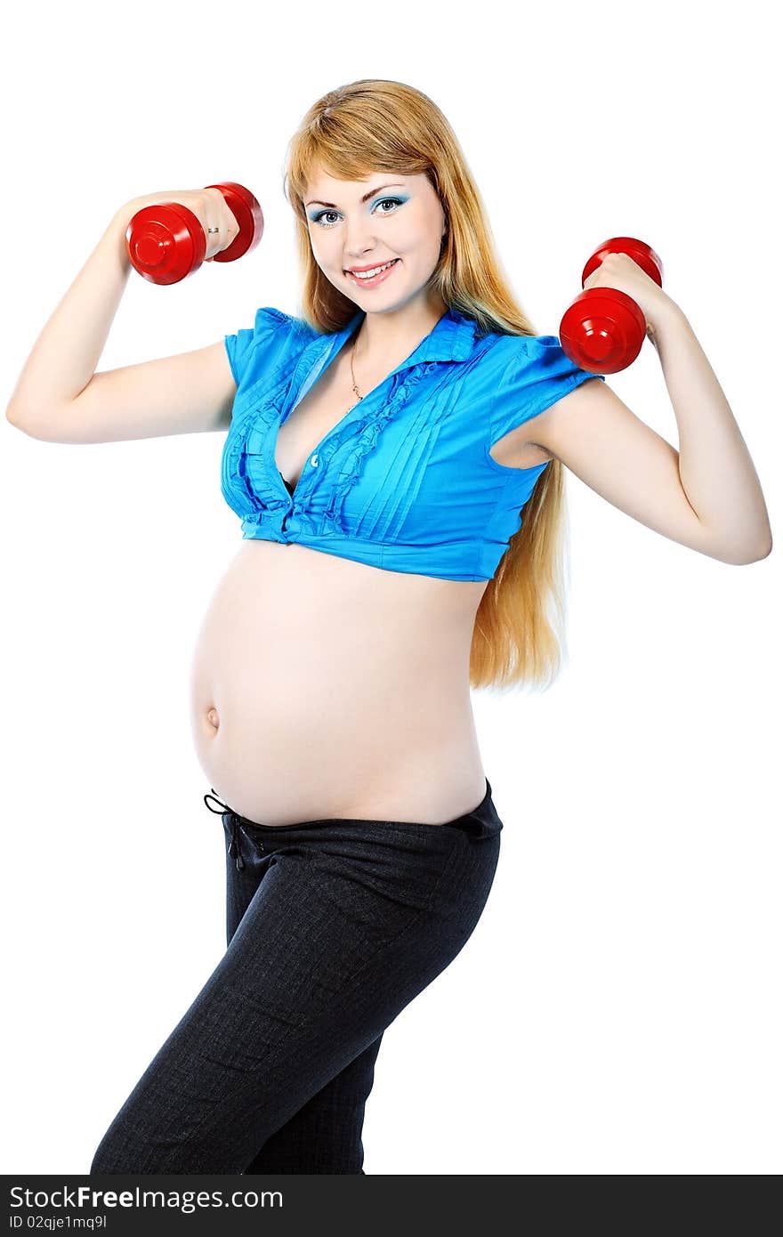 Portrait of pregnant woman training with dumbbells. Isolated over white background. Portrait of pregnant woman training with dumbbells. Isolated over white background.