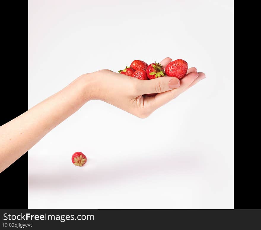 Red beautiful strawberry on palm