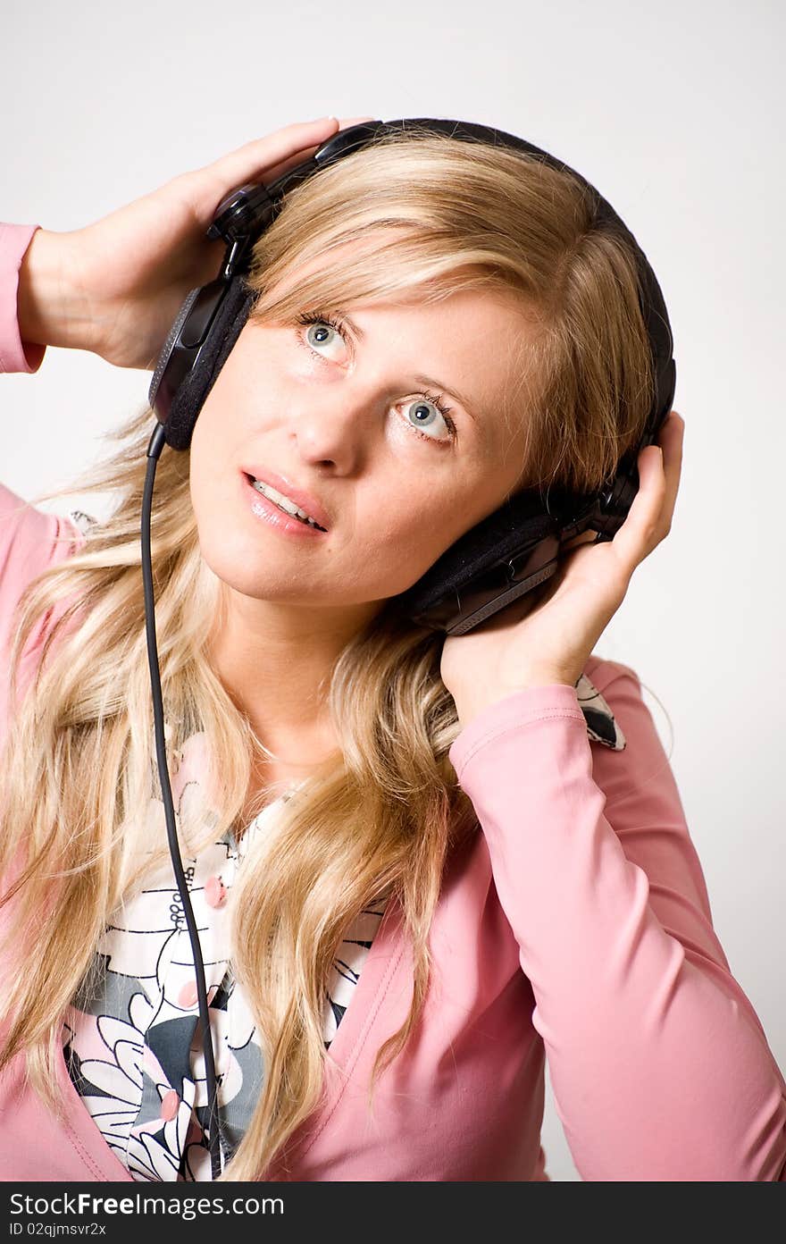 Young women with headphones in white background