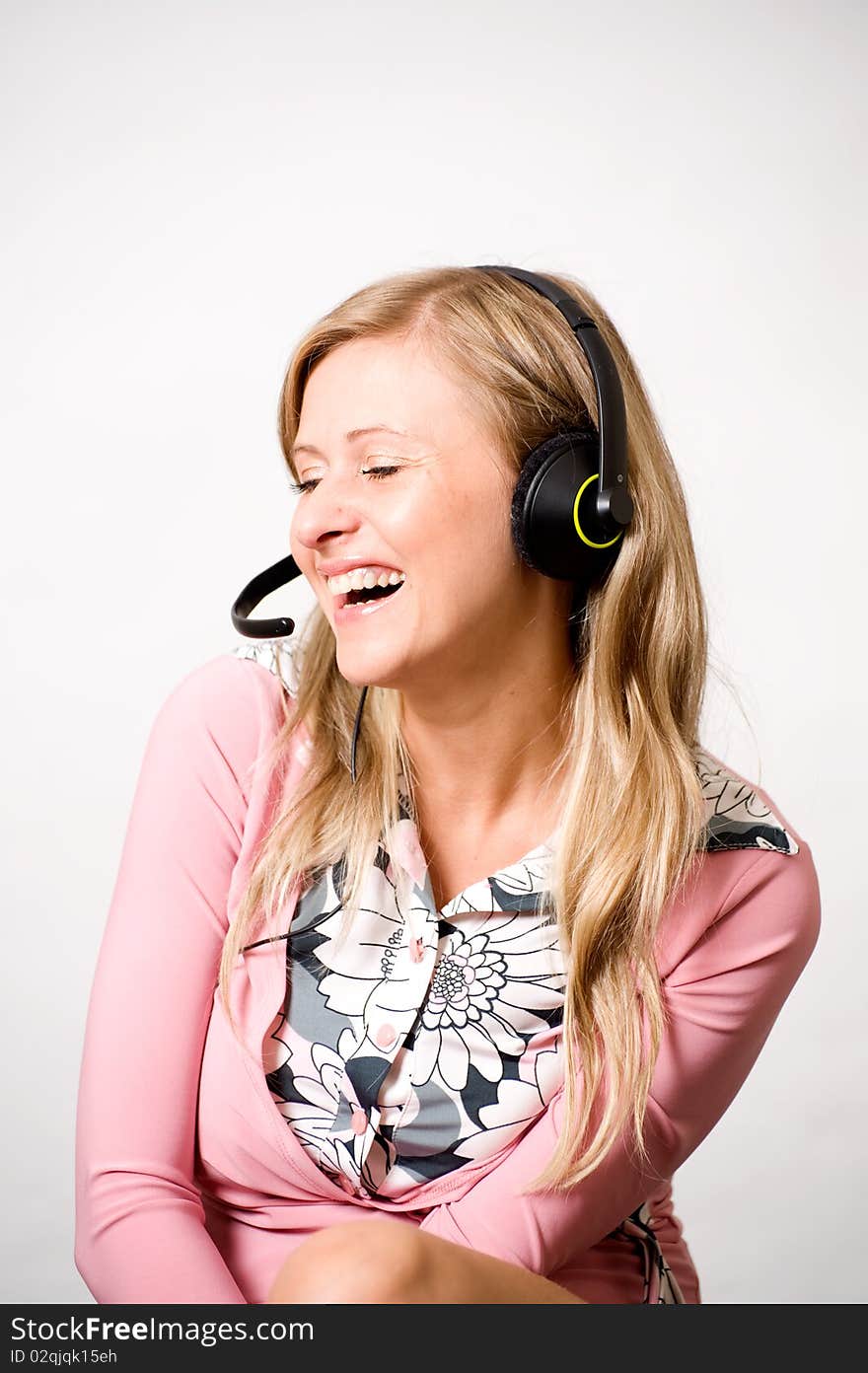 Women with headphones laughing of something