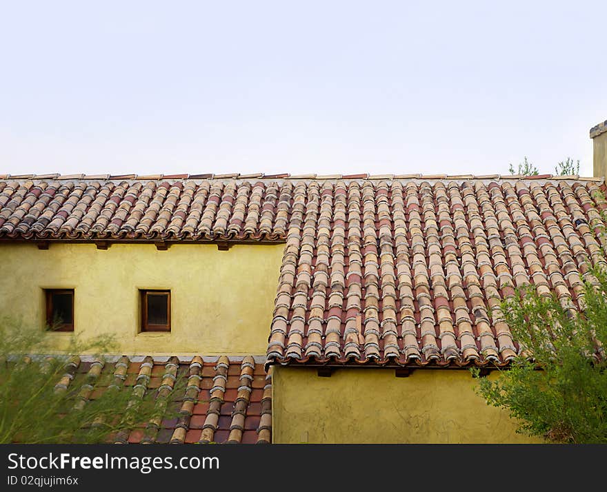 Old rustic roof top tiles on old home in Tuscany