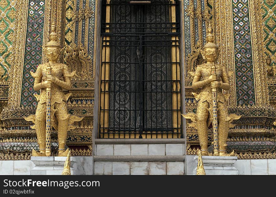 The golden guardians at The Emerald Buddha Temple in Bangkok, Thailand. The golden guardians at The Emerald Buddha Temple in Bangkok, Thailand.