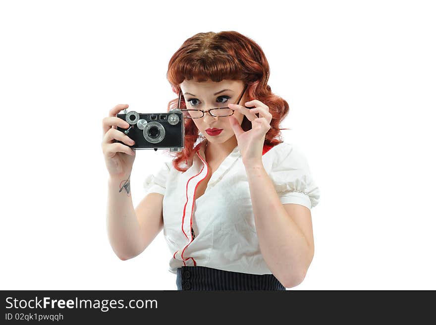 A sexy pin up librarian with a vintage camera. A sexy pin up librarian with a vintage camera.