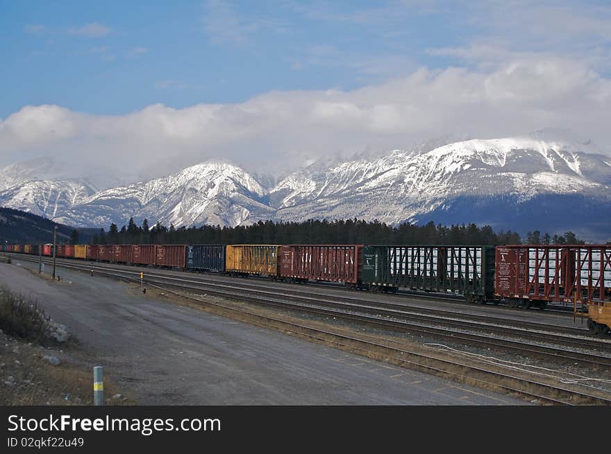 Freight carriages backing on to mountains, jasper. Freight carriages backing on to mountains, jasper.