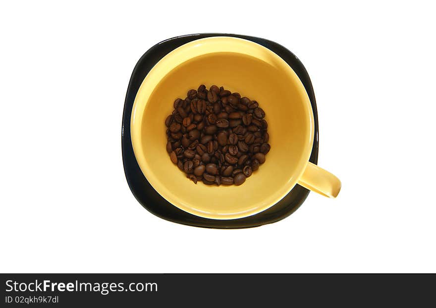 Large yellow cup and black saucer, top view