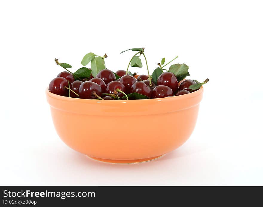 Fresh bright red cherry closeup, isolated on a white background. Fresh bright red cherry closeup, isolated on a white background