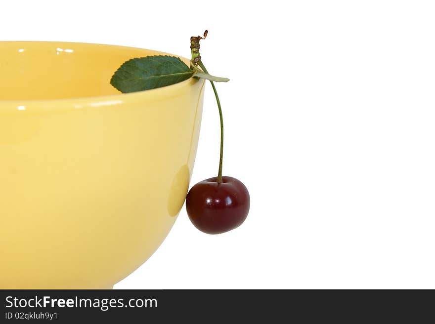 Fresh bright red cherry closeup, isolated on a white background. Fresh bright red cherry closeup, isolated on a white background