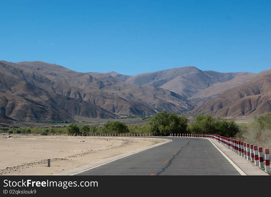 Yellowish mountain road view in tibet of China