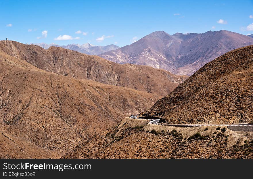 Yellowish mountain road view in tibet of China