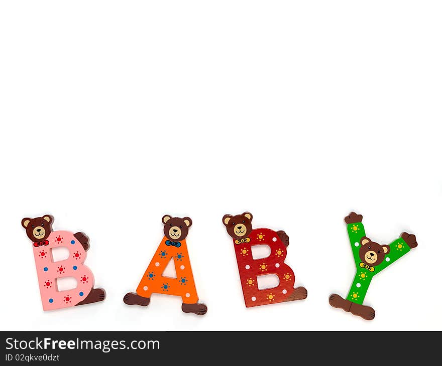 Wooden letters spelling baby isolated against a white background