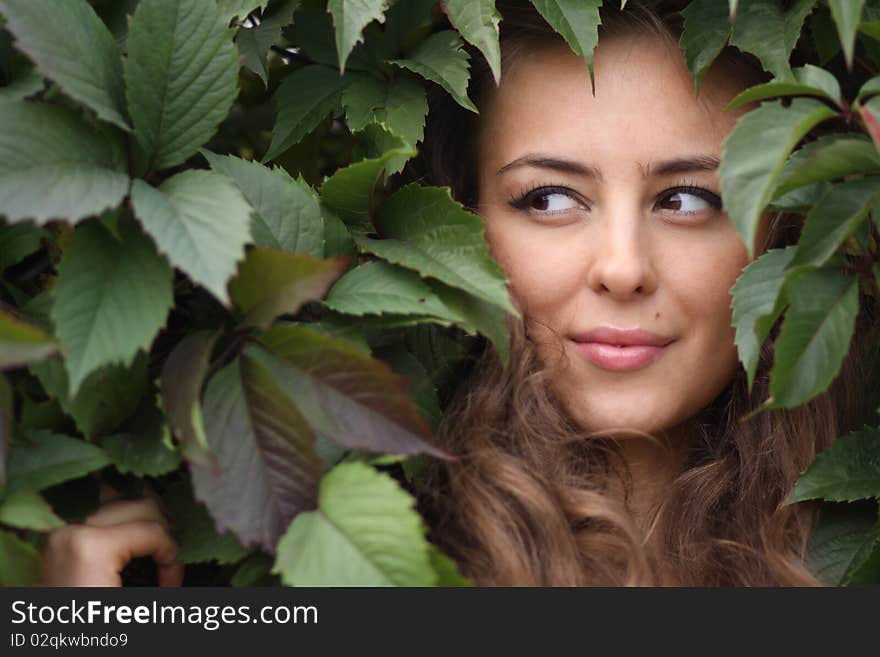 Girl In Green Foliage