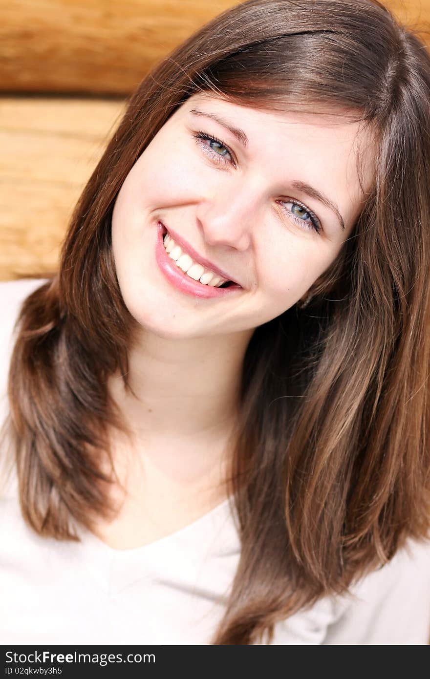 Beautiful young woman smiling. Outdoor portrait