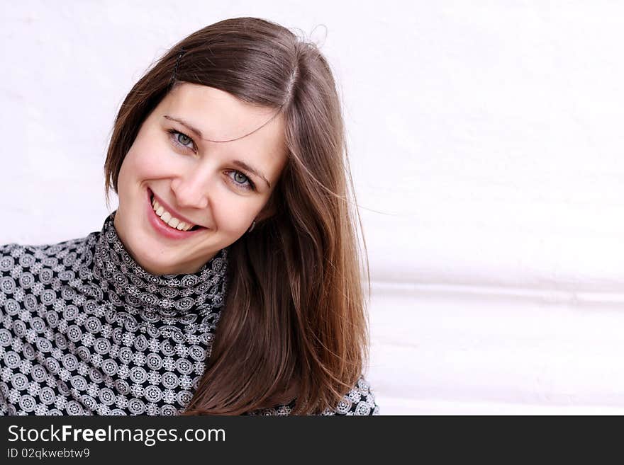 Beautiful young woman smiling. Outdoor portrait