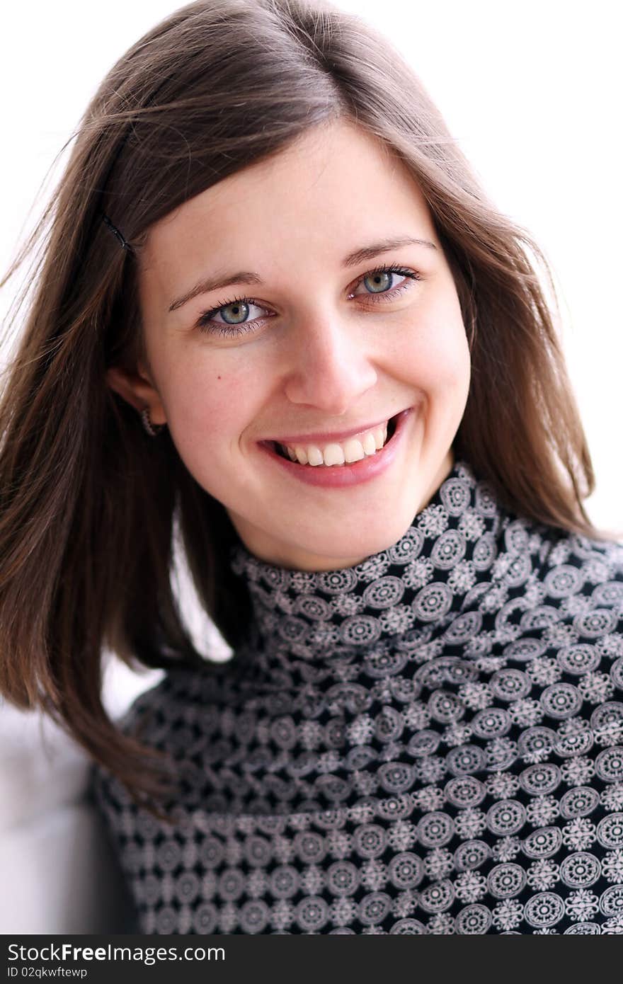 Beautiful young woman smiling. Outdoor portrait