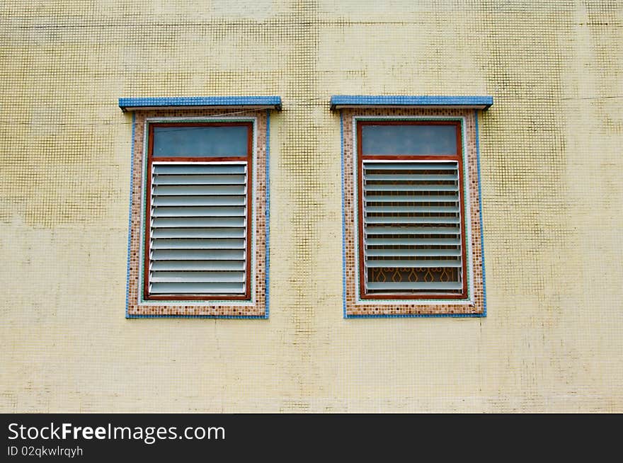 Two Traditional Windows On The Yellow Wall