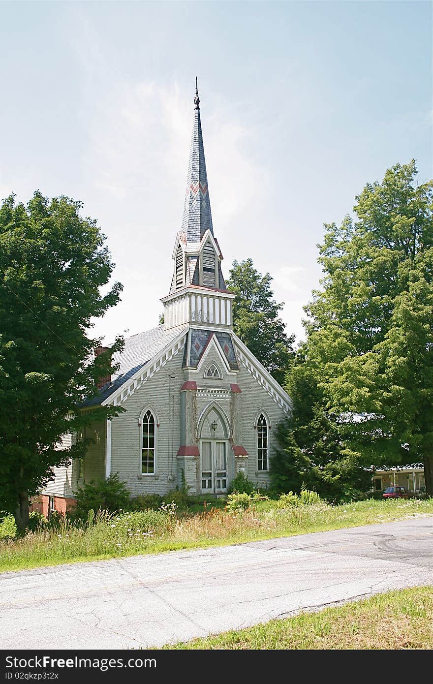 A beautiful old church with lots of detail sits in a small glen in Vermont. A beautiful old church with lots of detail sits in a small glen in Vermont.