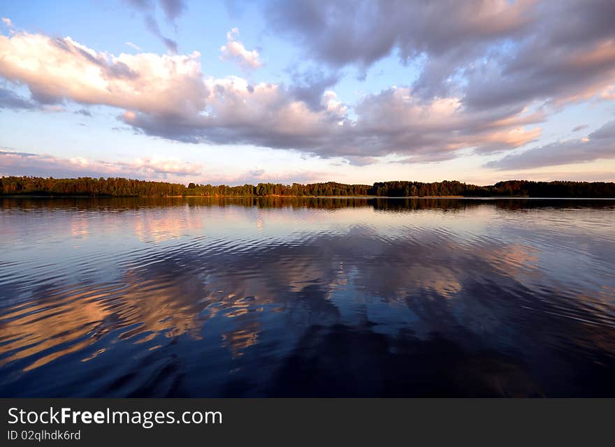 Lake in the evening and shadows on it. Lake in the evening and shadows on it