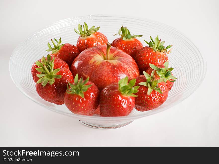 Strawberries And Apple In A Glass Bowl