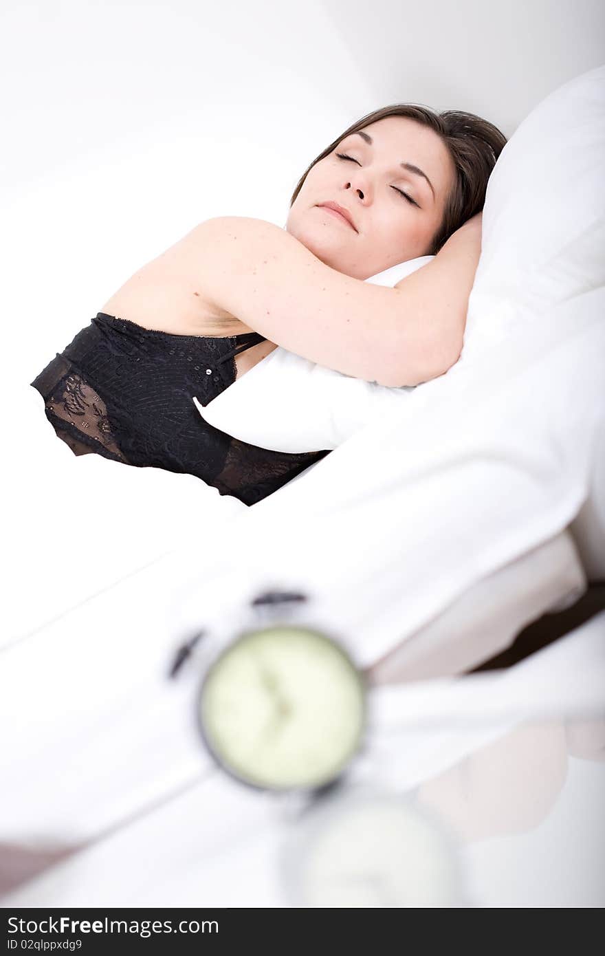 Young adult woman sleeping in bed. Young adult woman sleeping in bed