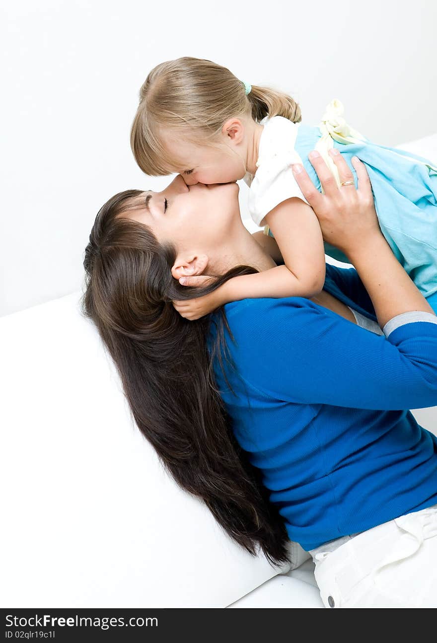 Mother and daughter having fun at home. Mother and daughter having fun at home