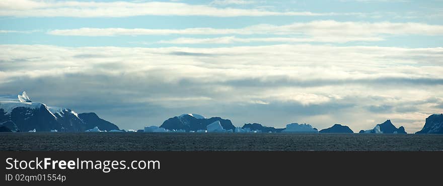 Southern Orkney Islands in antarctic area. Island and icebergs.