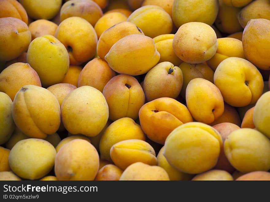 Fresh yellow apricots on the market