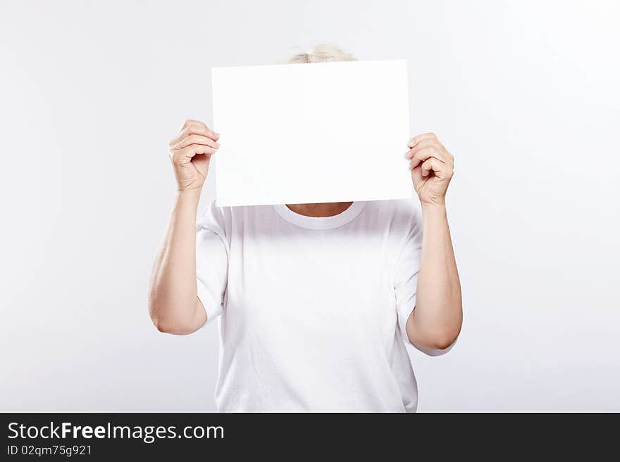 An elderly woman with an empty plate from a person on a white background. An elderly woman with an empty plate from a person on a white background