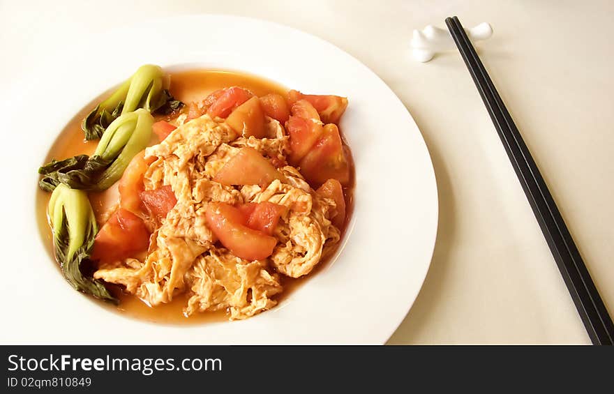 Scrambled eggs with tomatoes ,the most common home cooking in china. Scrambled eggs with tomatoes ,the most common home cooking in china.